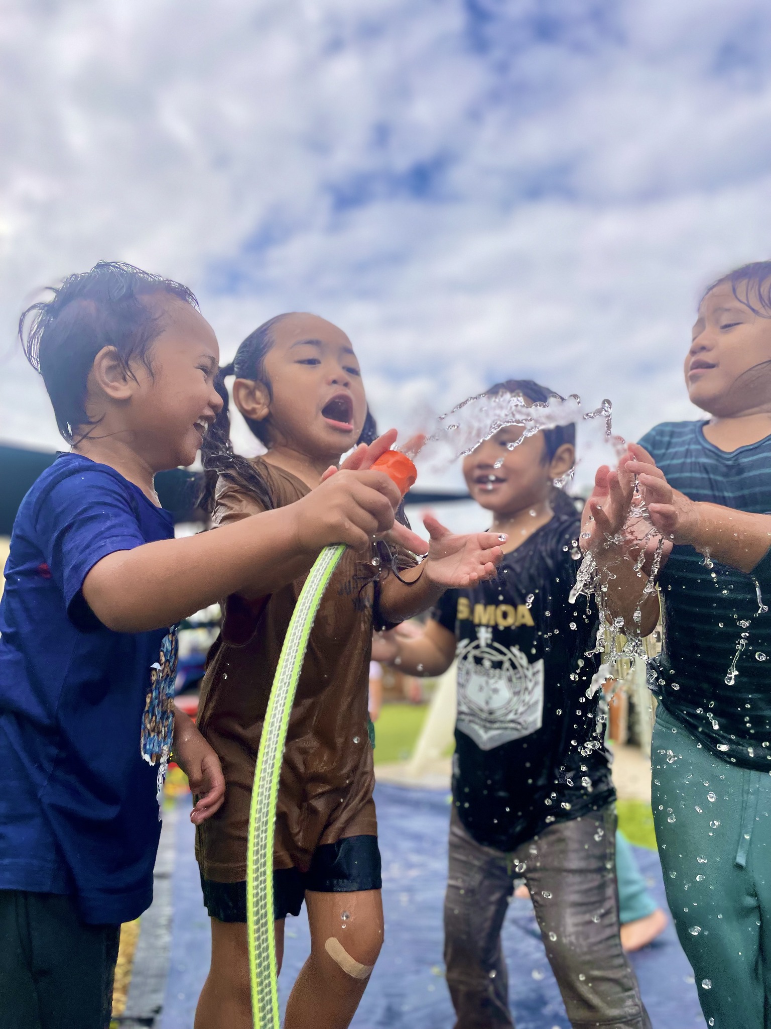 Tamariki playing with water at the centre